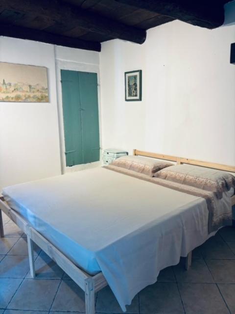a bedroom with a large bed in a room at Al Castello in Valeriano Lunense