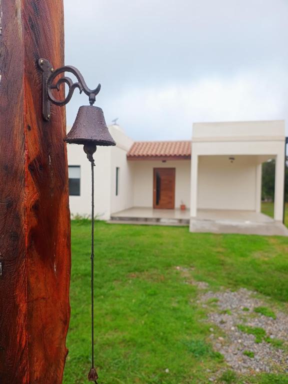 a metal light on the side of a house at Los 4 Vientos, Casa del Valle in San Javier