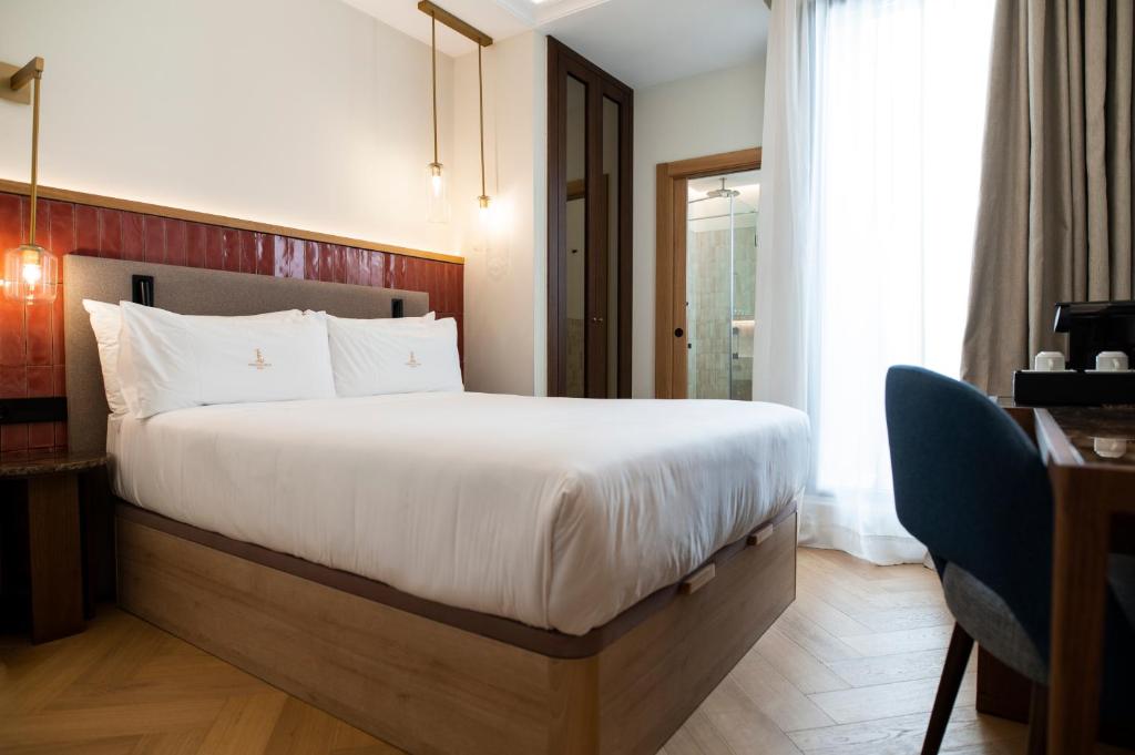 Postel nebo postele na pokoji v ubytování Legado Magdalena Hotel
