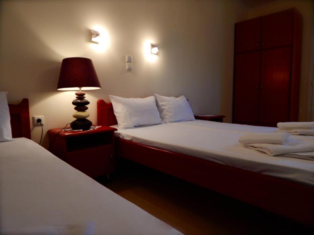A bed or beds in a room at Panorama Apartments and Studios