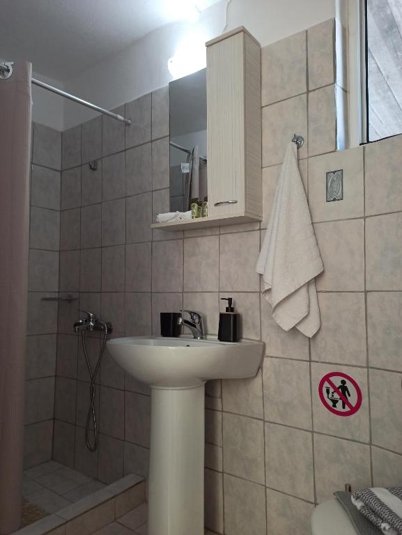 Koupelna v ubytování Poseidon Apartments