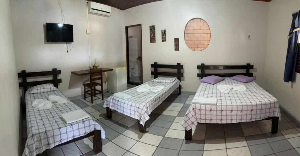 Postel nebo postele na pokoji v ubytování Hotel Colinas Douradas