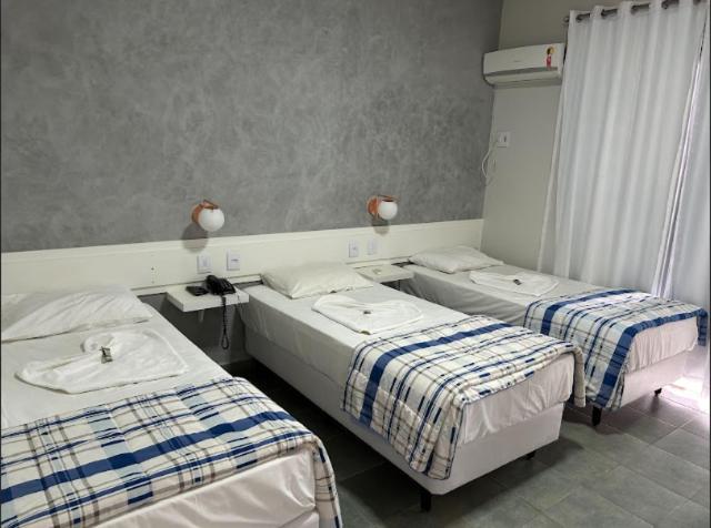 Postel nebo postele na pokoji v ubytování RADAR PÁLACE HOTEL