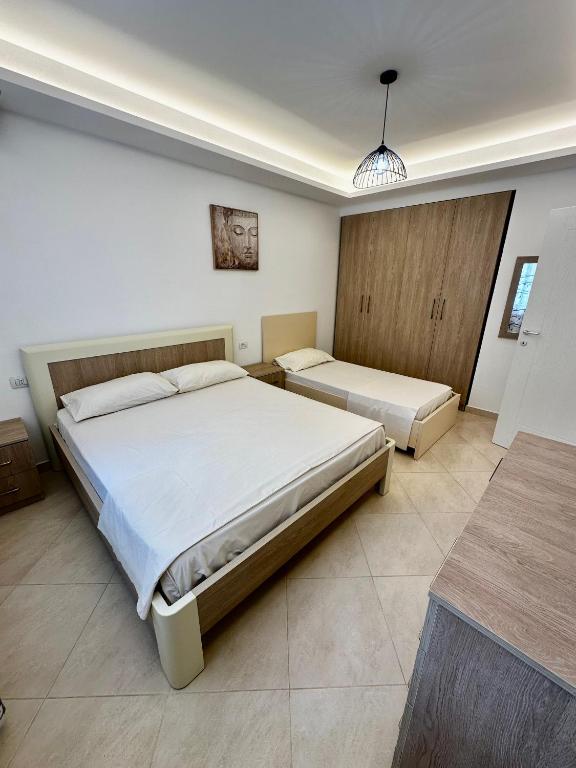Postel nebo postele na pokoji v ubytování Villa Arberia