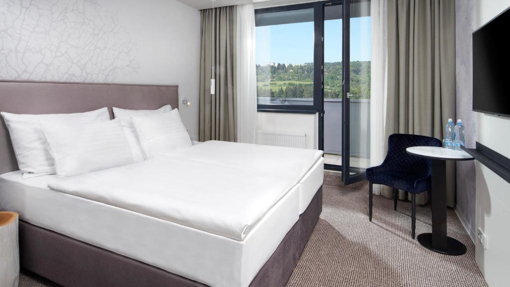 Letto o letti in una camera di OREA Resort Santon Brno