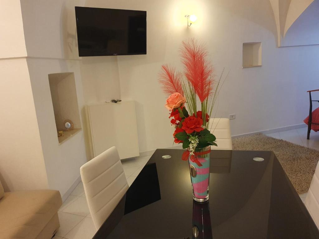 TV a/nebo společenská místnost v ubytování La Dimora del Conte By il Nido Di Edera