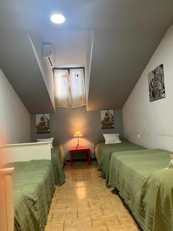 A bed or beds in a room at Aparment Puerta de sol