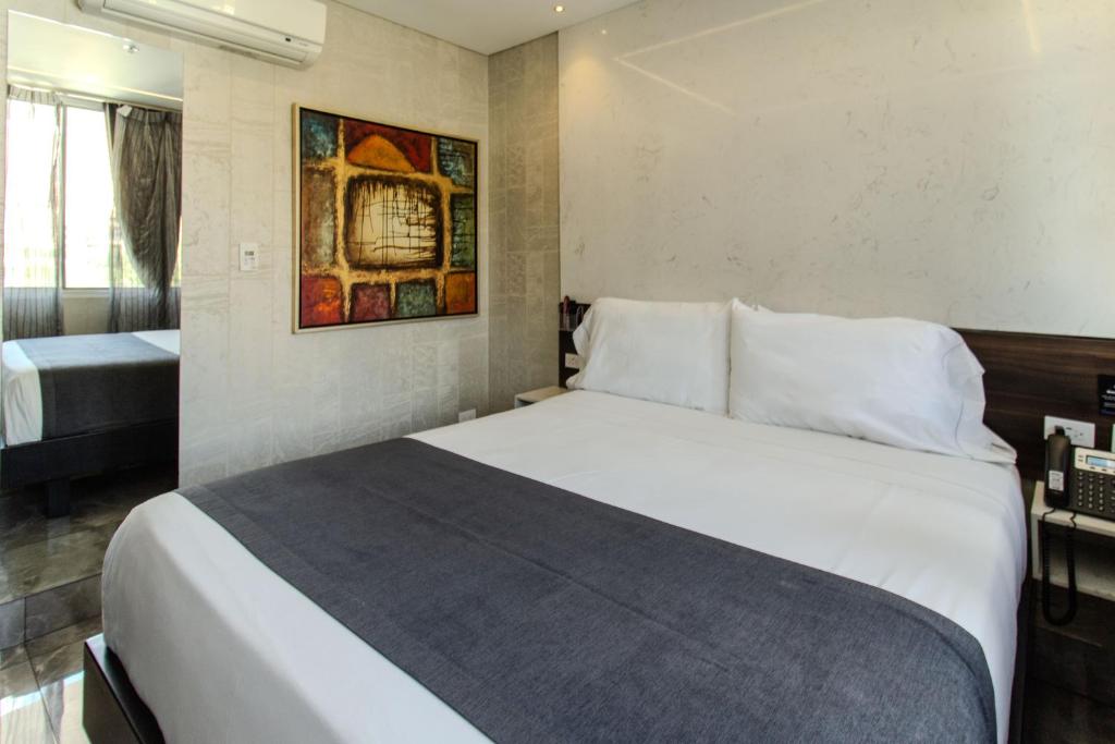 Postel nebo postele na pokoji v ubytování Haven A Design Hotel