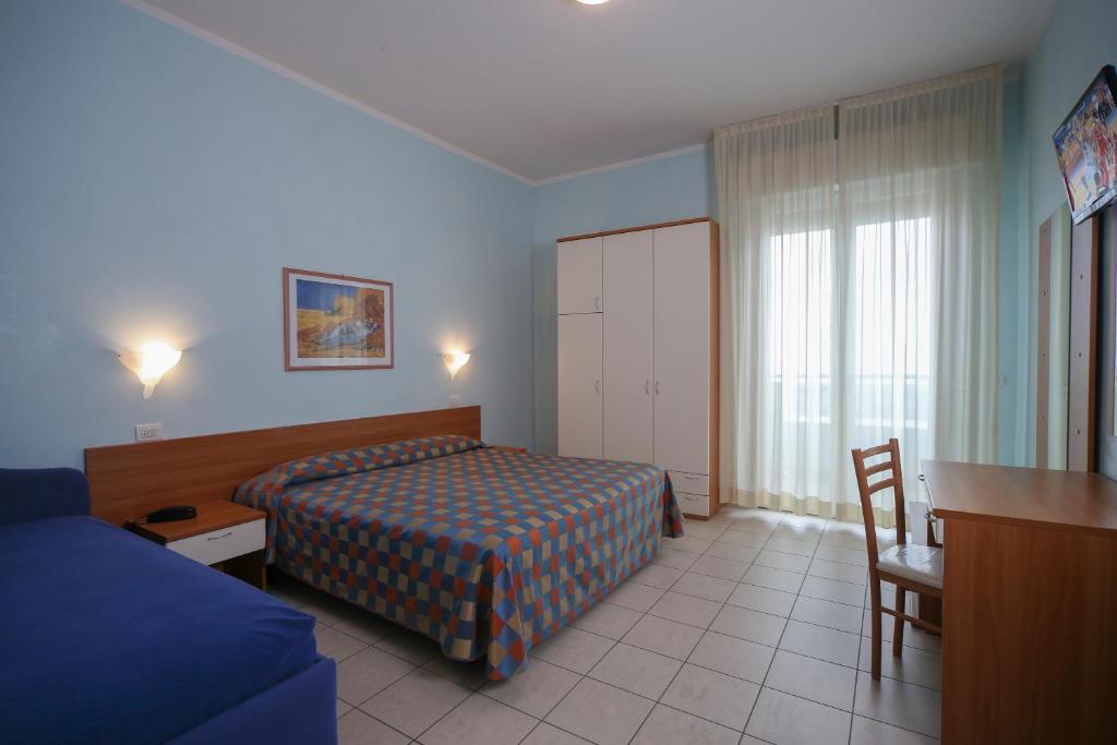 Postel nebo postele na pokoji v ubytování Hotel Iones