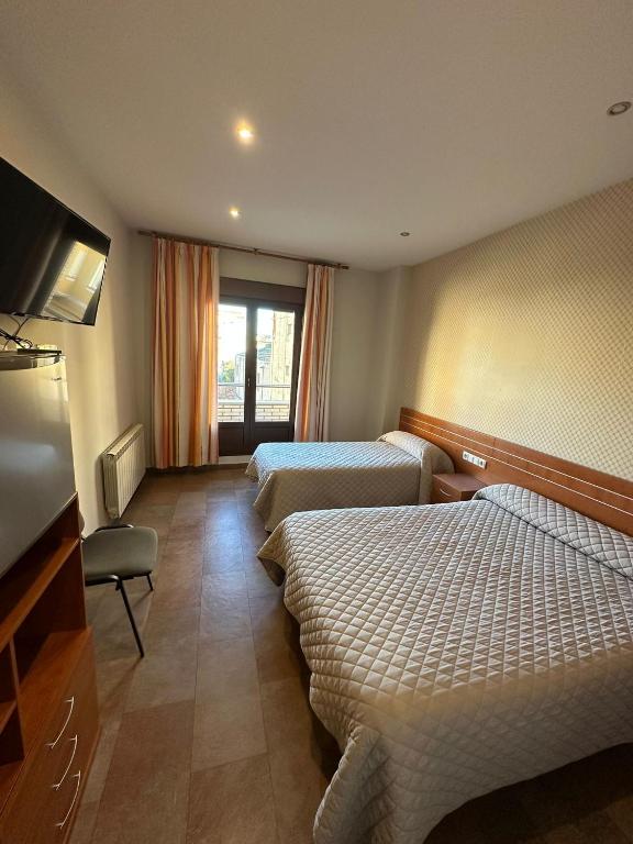 Postel nebo postele na pokoji v ubytování Hostal Venecia