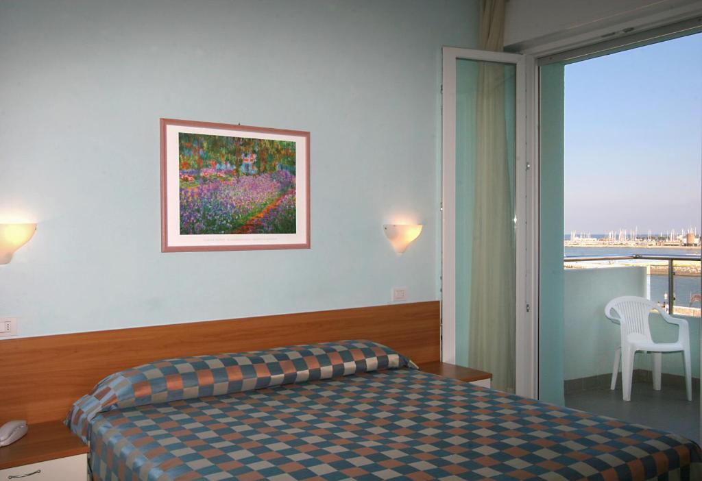 Postel nebo postele na pokoji v ubytování Hotel Iones