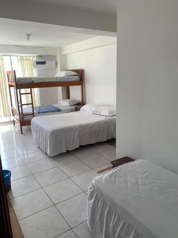 Postel nebo postele na pokoji v ubytování HOTEL PAL-MAR