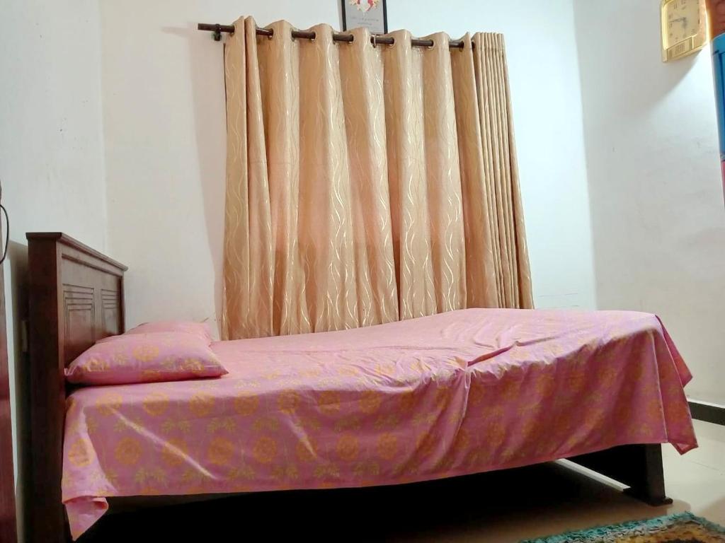 Postel nebo postele na pokoji v ubytování Beach Guest Inn