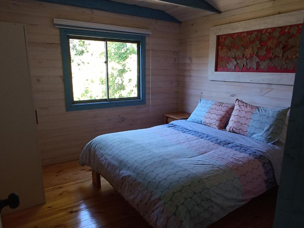 Ένα ή περισσότερα κρεβάτια σε δωμάτιο στο Cabaña Osanvile