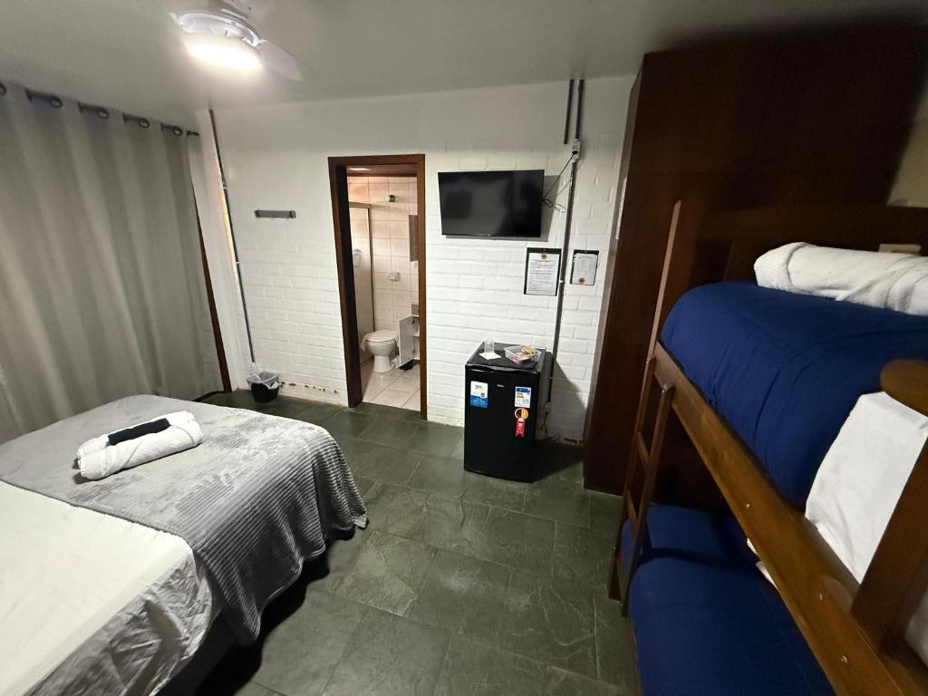 Postel nebo postele na pokoji v ubytování Pousada Trilha da Serra