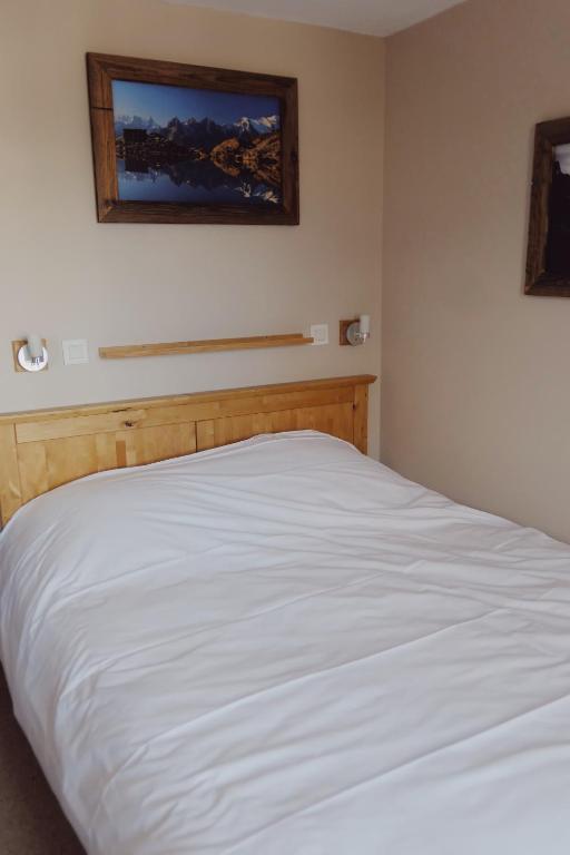 Posteľ alebo postele v izbe v ubytovaní Appartement Courchevel la Tania