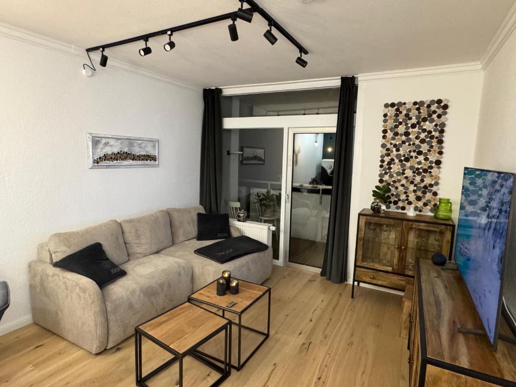 a living room with a couch and a table at Apartment Bellevue Bad Harzburg in Bad Harzburg