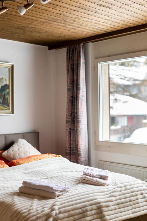 Postel nebo postele na pokoji v ubytování Alpenblick Loft neben Skilift in Amden Arvenbüel