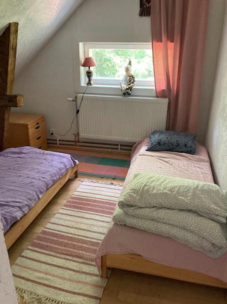 Postel nebo postele na pokoji v ubytování Outintic House