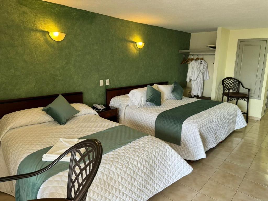 Postel nebo postele na pokoji v ubytování Hotel Bello Cordoba