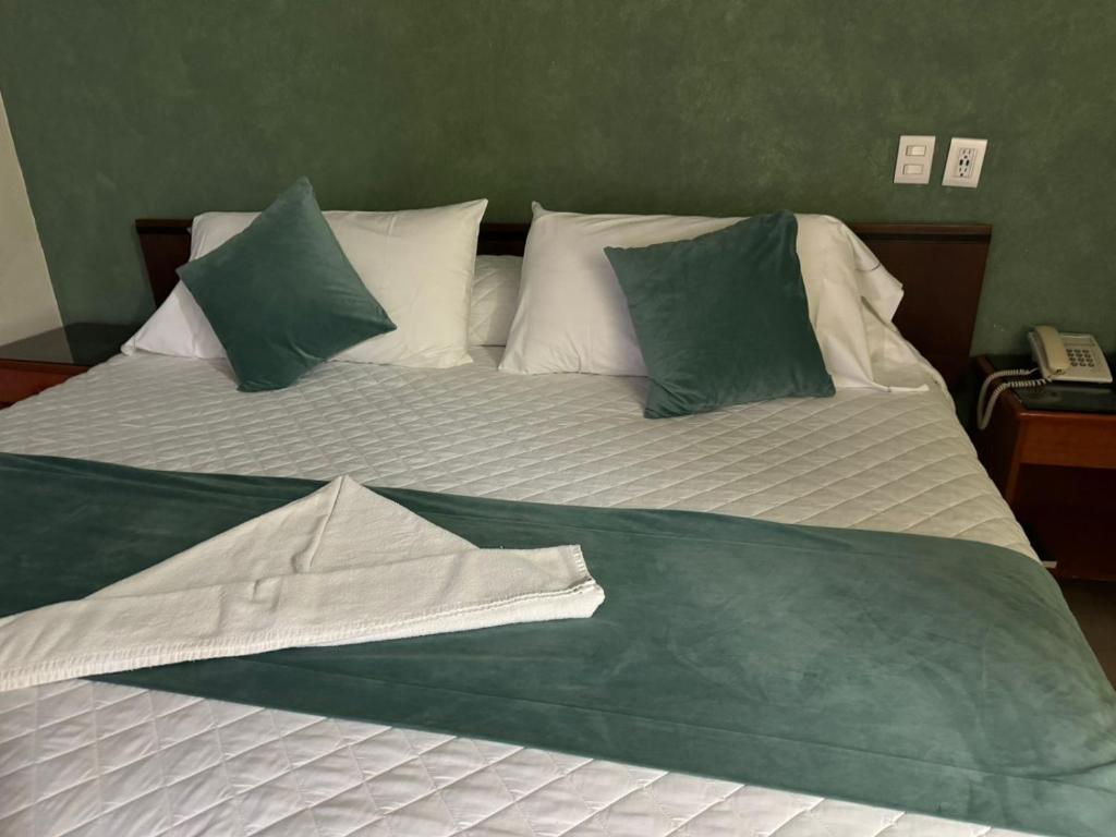 Postel nebo postele na pokoji v ubytování Hotel Bello Cordoba