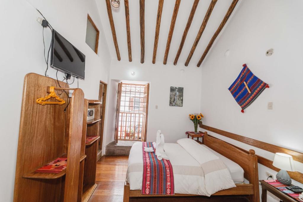 TV a/nebo společenská místnost v ubytování Hostal El Grial