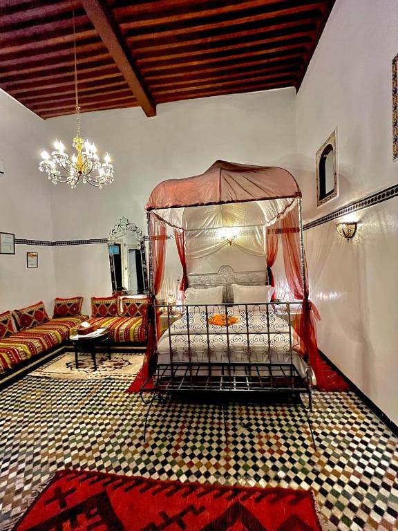 Postel nebo postele na pokoji v ubytování Riad Lalla Zoubida