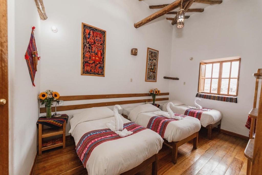 Postel nebo postele na pokoji v ubytování Hostal El Grial