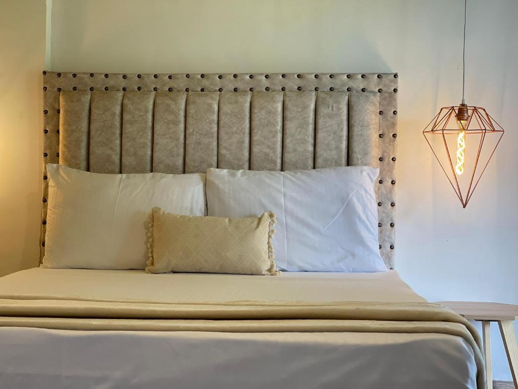 Postel nebo postele na pokoji v ubytování Dreams Hotel y Restaurante