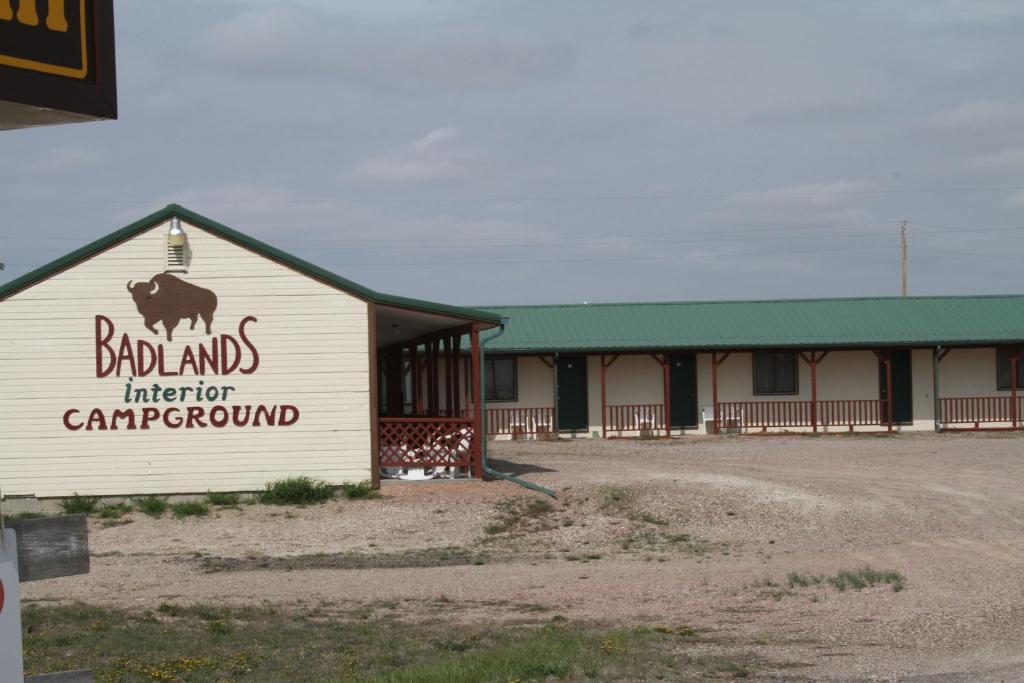 a building with a sign on the side of it at Badlands Hotel & Campground in Interior