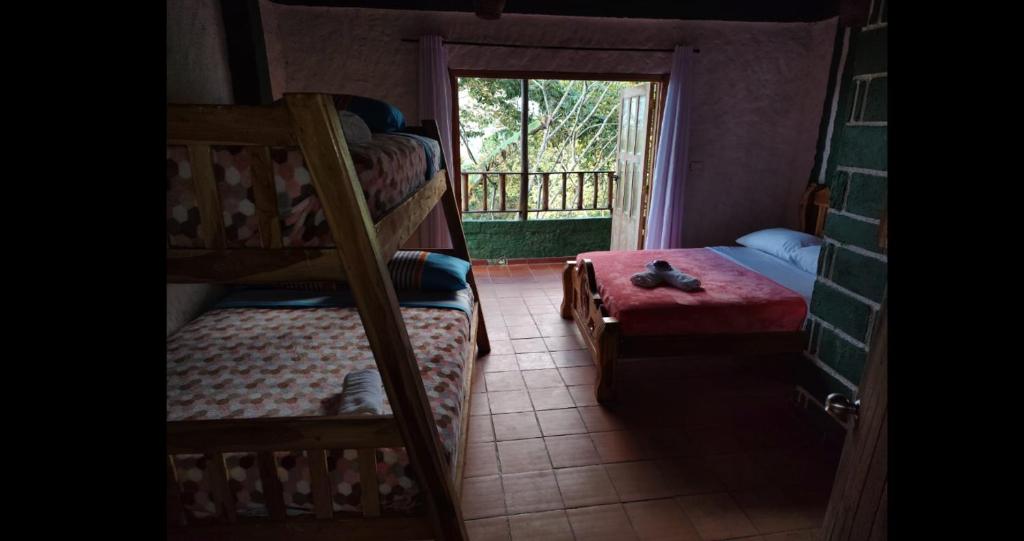 Postel nebo postele na pokoji v ubytování Hotel El Santuario