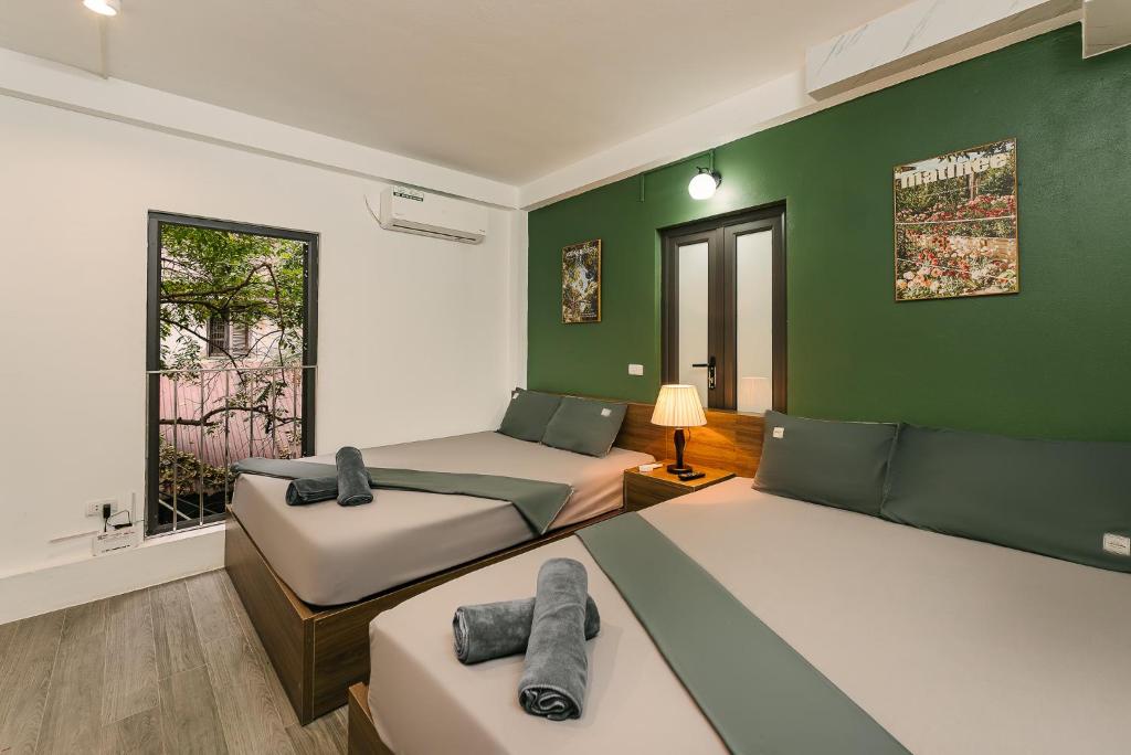Postel nebo postele na pokoji v ubytování Toycan House - 50m to Hoan Kiem lake