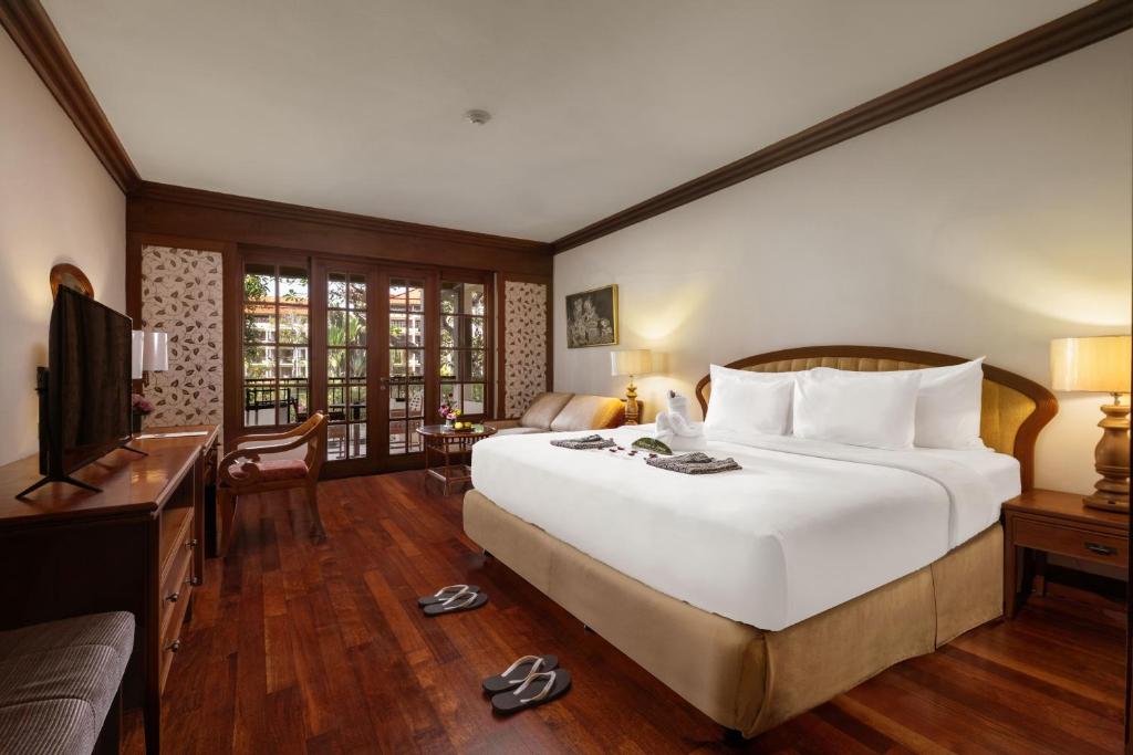 Postel nebo postele na pokoji v ubytování Ayodya Resort Bali