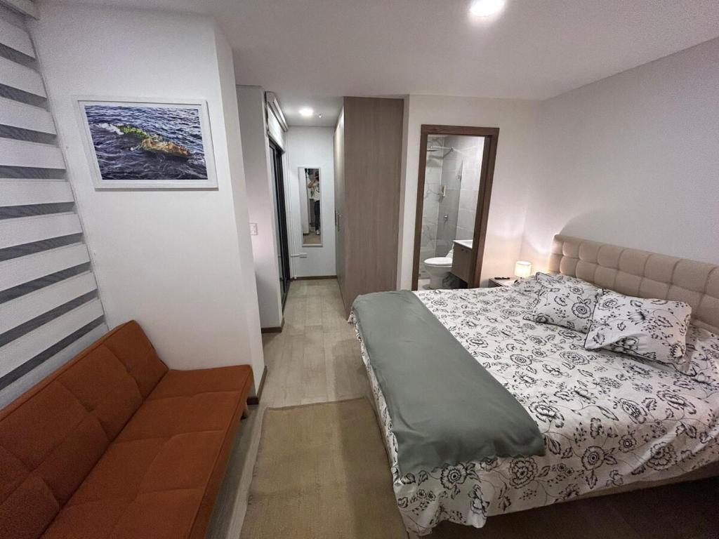 Voodi või voodid majutusasutuse Mini suite cerca del parque La Carolina Quito toas