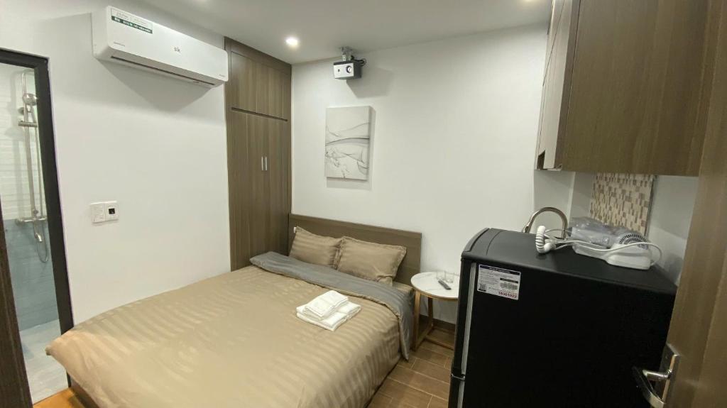 Postel nebo postele na pokoji v ubytování Era Apartment - Chùa Láng