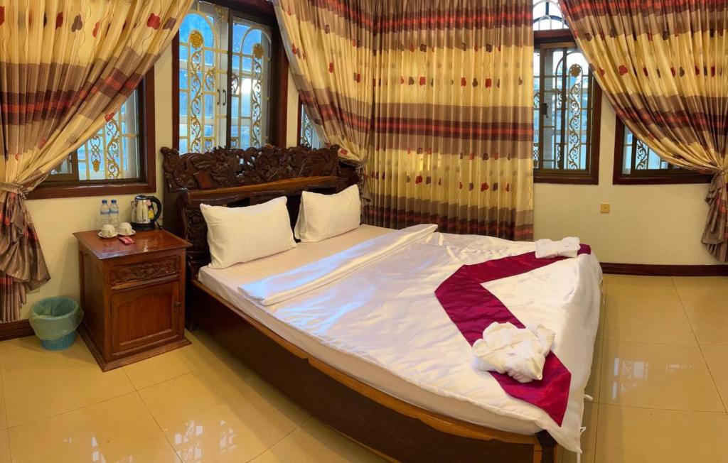 Postel nebo postele na pokoji v ubytování Lotus Blanc Homestay Villa