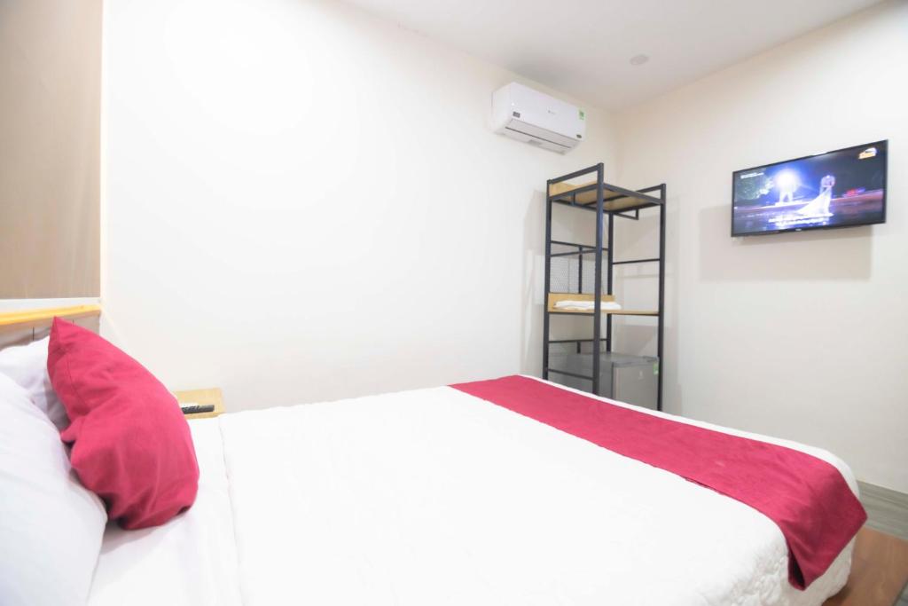 Postel nebo postele na pokoji v ubytování Hoàng Bách Hotel Vũng Tàu