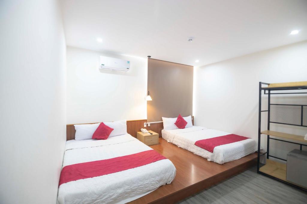 Postel nebo postele na pokoji v ubytování Hoàng Bách Hotel Vũng Tàu