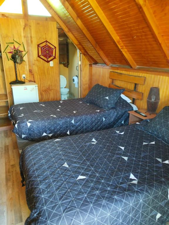 Postel nebo postele na pokoji v ubytování Hostal Cactus Copiapo