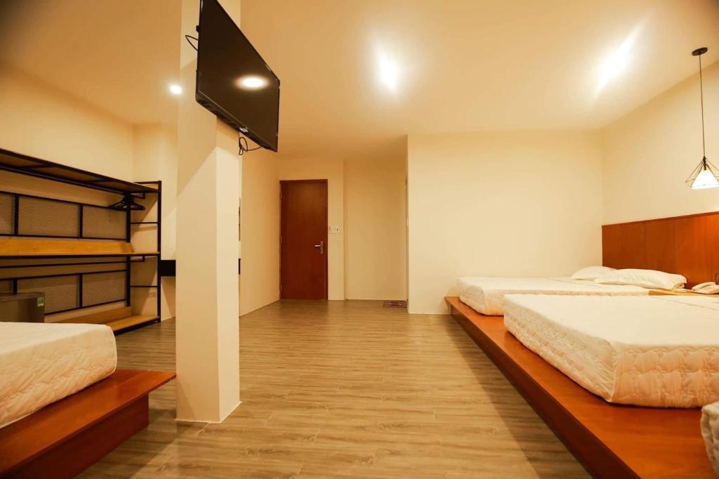 Postel nebo postele na pokoji v ubytování Hoàng Bách Hotel Vũng Tàu
