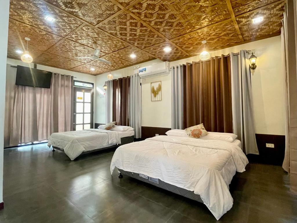 Postel nebo postele na pokoji v ubytování EL SUEÑO RESORT