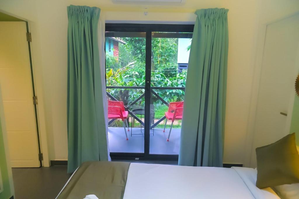 Postel nebo postele na pokoji v ubytování Bay View Suites, Vythiri, Wayanad