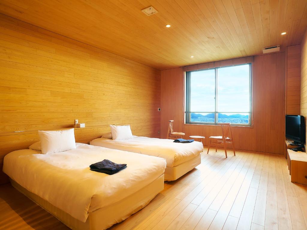 Postel nebo postele na pokoji v ubytování Setre Highland Villa Himeji