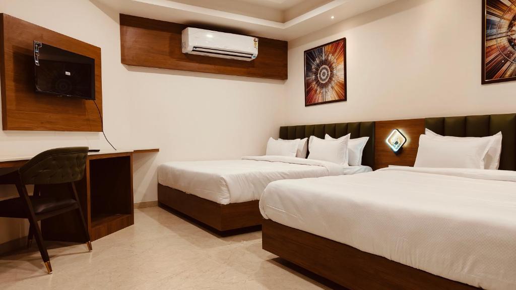 Rúm í herbergi á Soil to Soul Trinity Hotel - A Boutique Stay