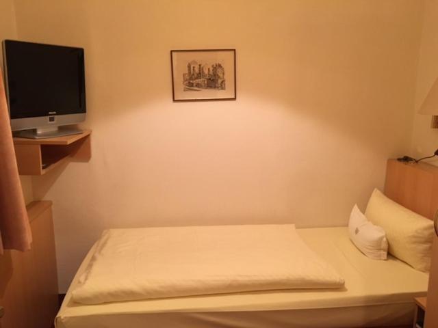 Postel nebo postele na pokoji v ubytování Hotel Benn