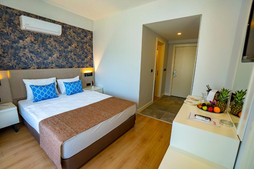 Postel nebo postele na pokoji v ubytování Eldar Garden Resort