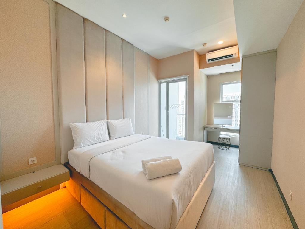 Postel nebo postele na pokoji v ubytování Well Furnished 1BR at Anderson Supermall Mansion Apartment By Travelio