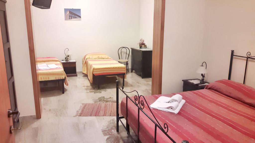 A bed or beds in a room at Spacious Apartment in Trapani + AC