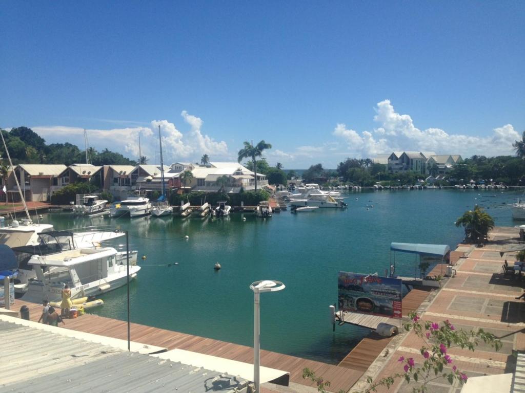 a view of a marina with boats in the water at Karukera Lodge in Le Gosier