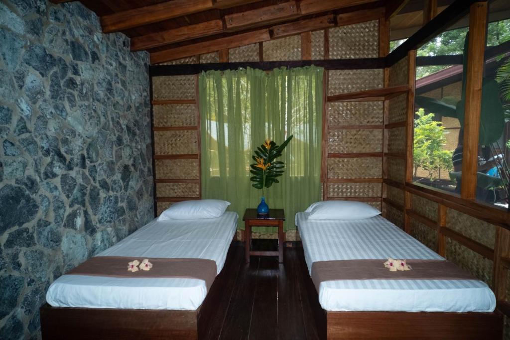 Postel nebo postele na pokoji v ubytování Kiao Beach